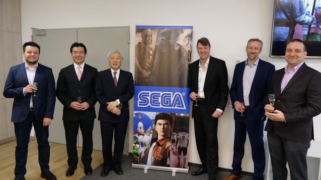 SEGA and SNK CEO posing for a picture