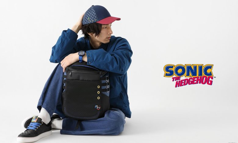 SuperGroupies model sitting wearing all four items in the Sonic collection