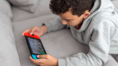 Child playing Nintendo Switch on the couch