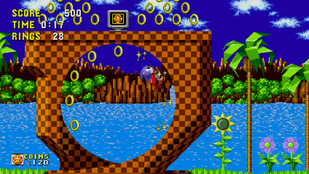 Sonic running in around a loop, collecting rings in Green Hill Zone.