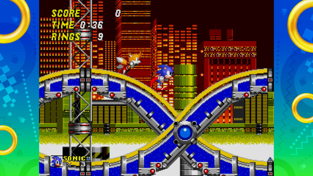 Sonic the Hedgehog and Tails running on a blue and yellow downward slope.