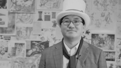 Yuji Naka wearing Balan Wonderland hat