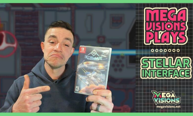 Chris Powell holding Stellar Interface game